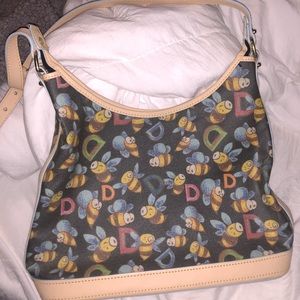 Dooney & Bourke black bee purse and white wristlet